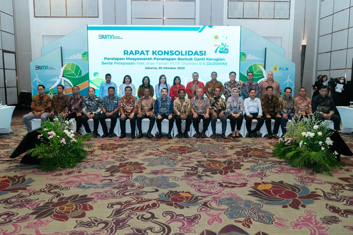 PLN team on stage at a corporate consolidation meeting